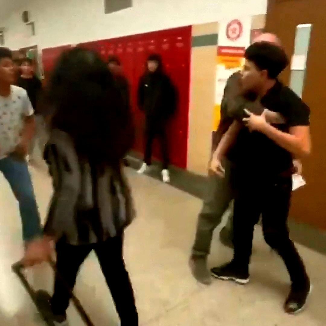 Illustrative photograph: Hallway Chaos: Teacher’s Bold Stand Against Student Brawl Ignites Explosive Standoff in Viral Video • Uncut Exchange Inside