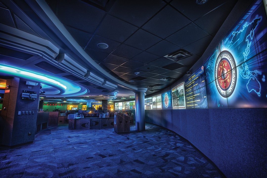 Cybersecurity analysts evaluate network anomaly alerts and perimeter firewall telemetry inside an operations center.