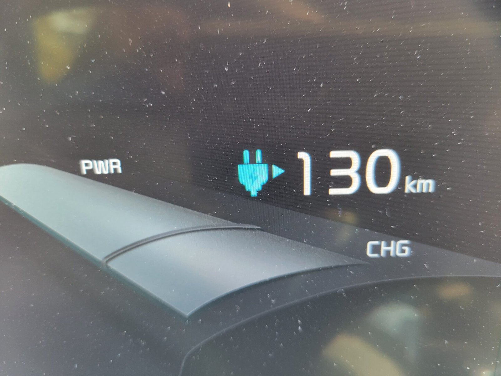 Digital driver telemetry display indicating kilowatts delivered, battery state of charge, and real-time charging rates.