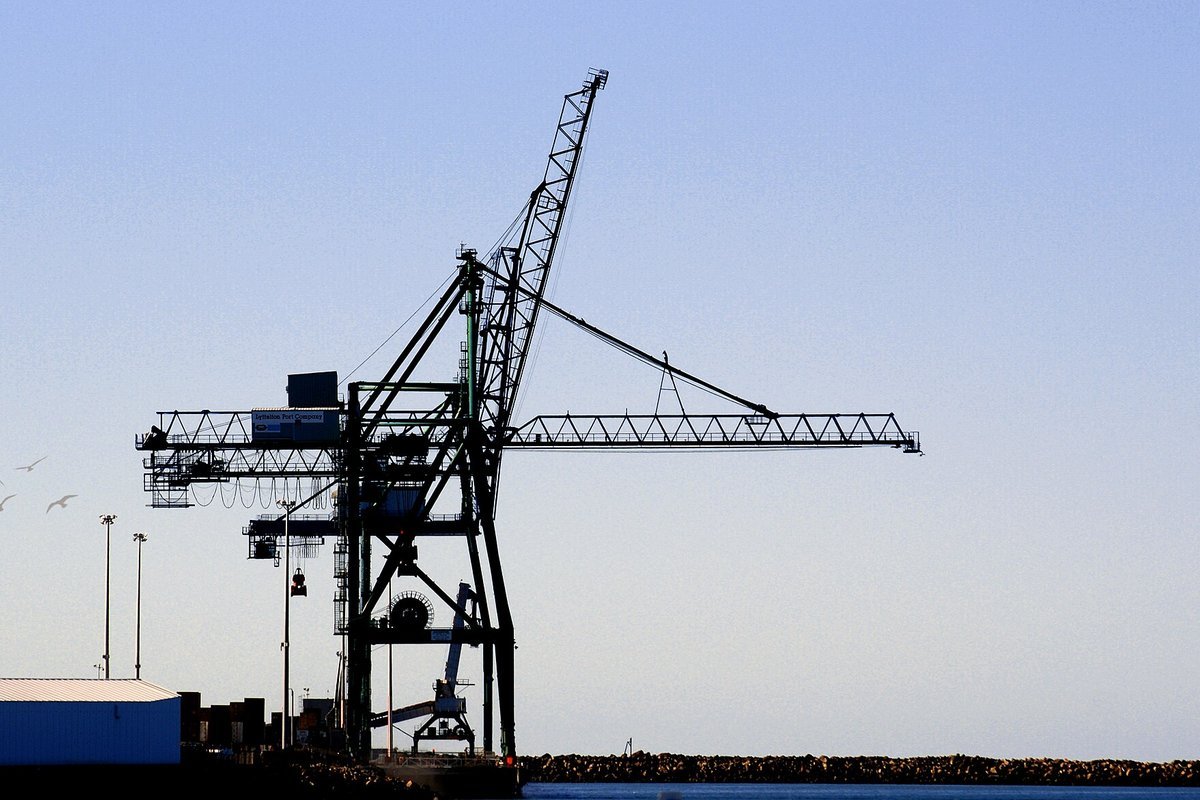 Super post-Panamax ship-to-shore gantry cranes handling containerized freight at the Port of Charleston