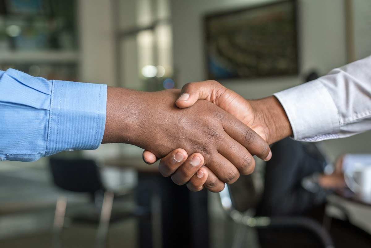 Civic and business leaders discussing a municipal development agreement
