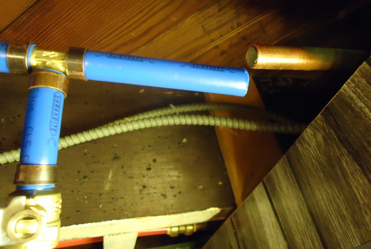 Modern copper water service line piping installed to replace legacy lead plumbing connections