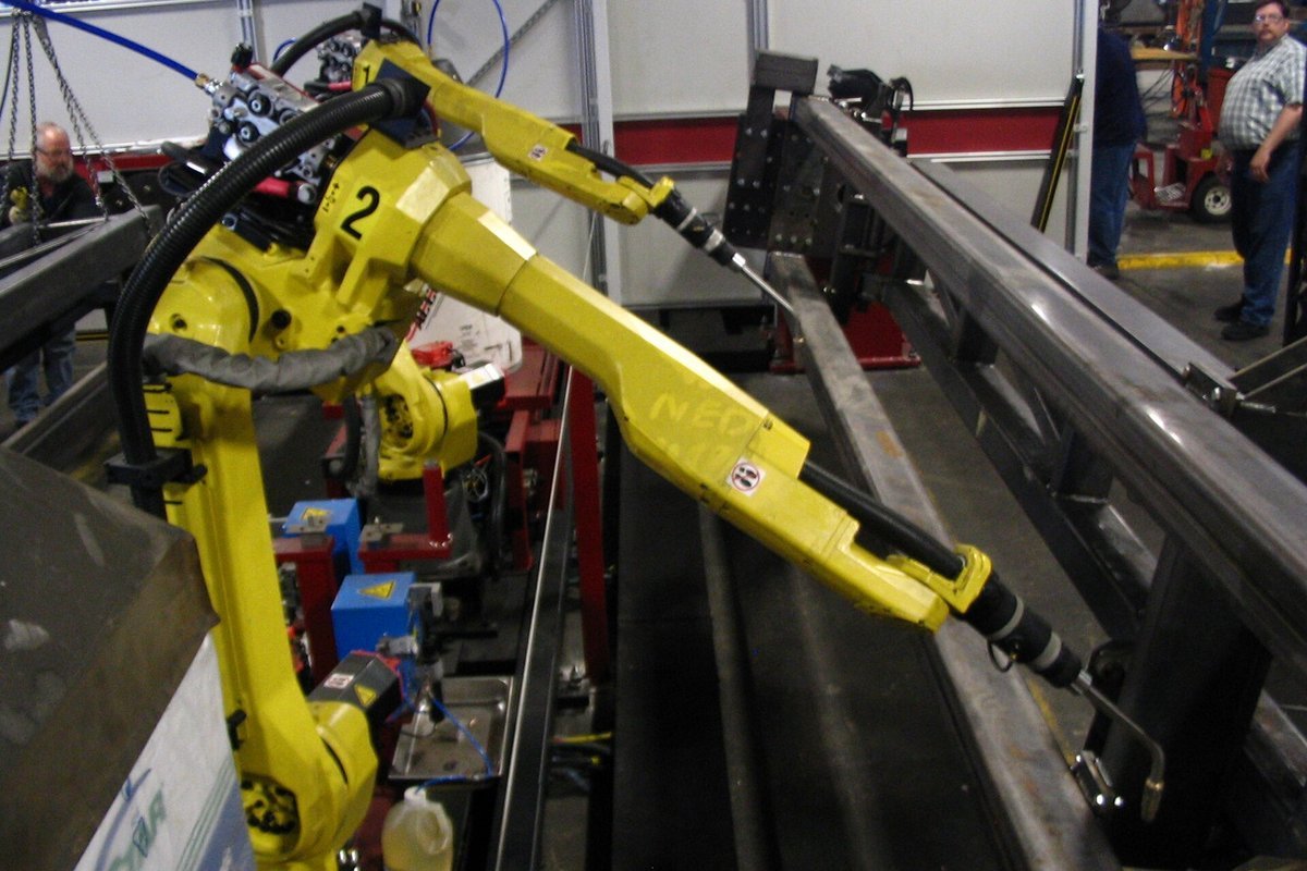 Industrial robotics assembly line executing automated vehicle manufacturing in the American Midwest