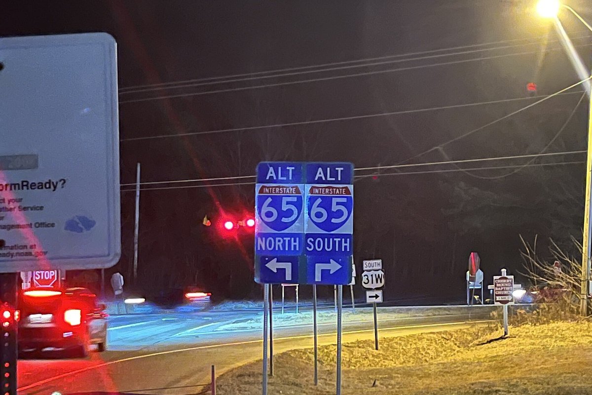 Commercial freight trucks navigating the Interstate 65 automotive manufacturing corridor in Kentucky