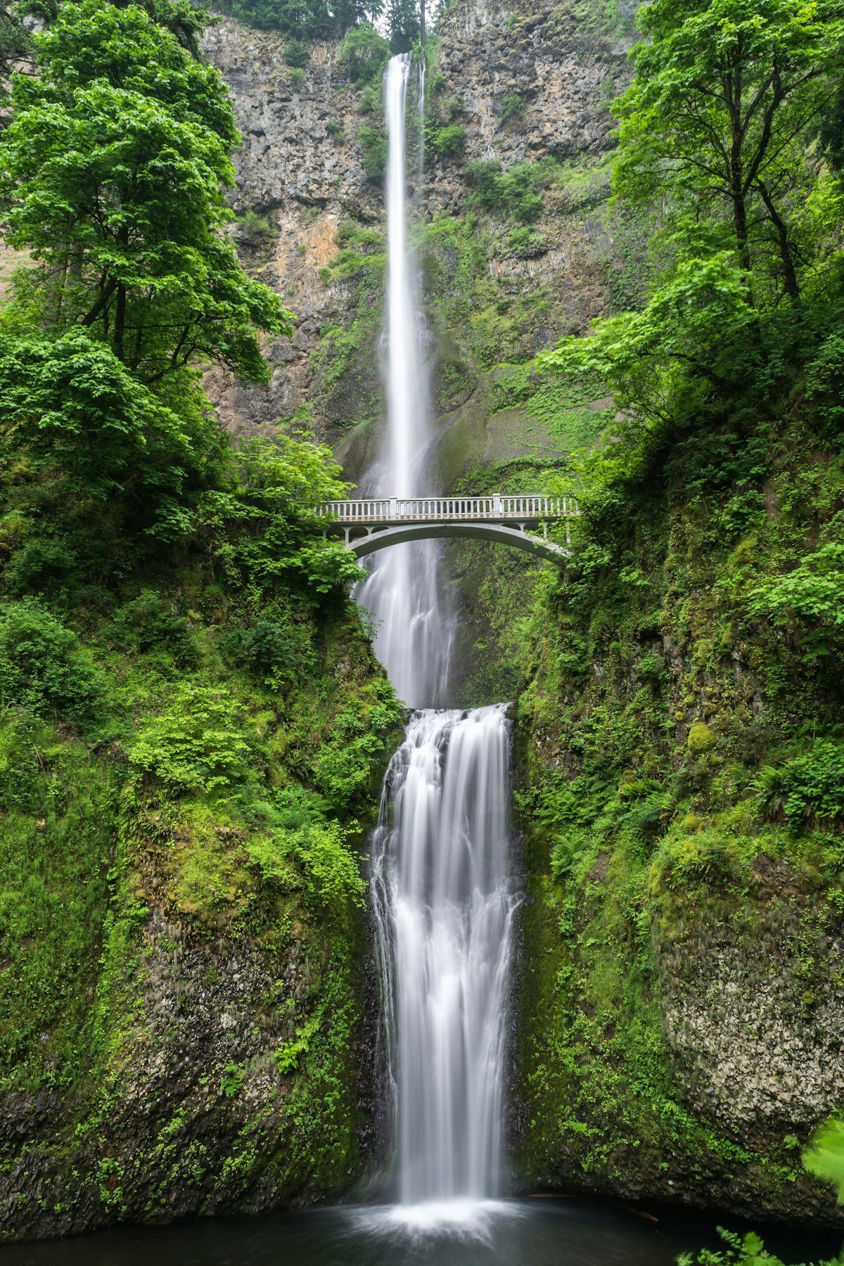 Mountain stream waterfall and pristine environmental freshwater resources