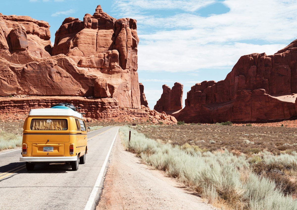 Remote desert highway traversing the expansive sagebrush basin of rural Nevada