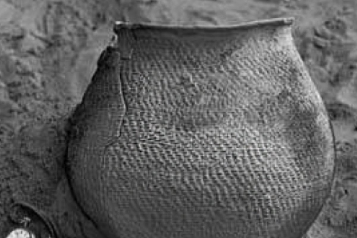 Traditional handcrafted Native American Pueblo ceramic pottery displaying authentic earth-tone mineral glazes
