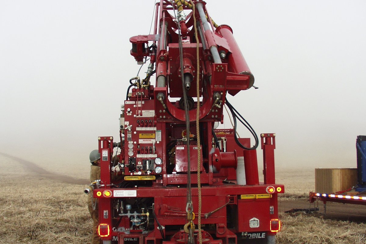 Deep groundwater well drilling rig installing a certified potable residential water supply well